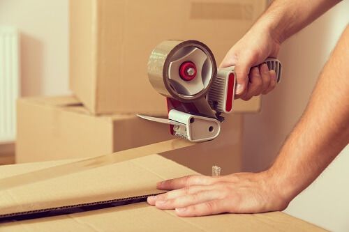 Parent packing moving boxes